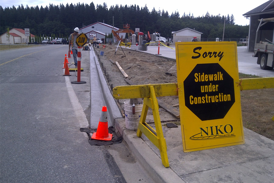 Niko Projects pouring concrete sidewalks in Powell River, BC