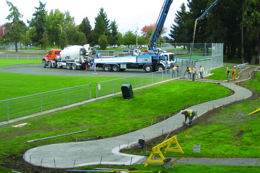 Niko Projects using a pump truck to pour concrete sidewalks in Parksville, BC